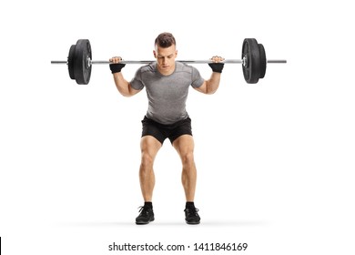 Full length portrait of a fit guy lifting weights isolated on white background