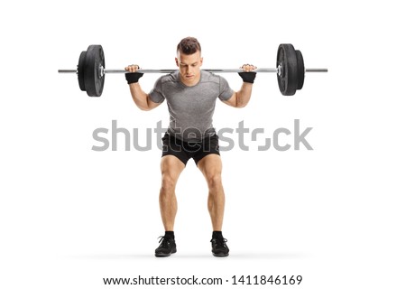Full length portrait of a fit guy lifting weights isolated on white background