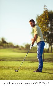 Full Length Portrait Of A Golfer.