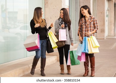 Full Length Portrait Of A Group Of Rich Women Walking Around A Mall With A Lot Of Shopping Bags