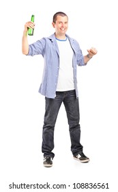 Full Length Portrait Of A Guy Holding A Beer Bottle Isolated On White Background