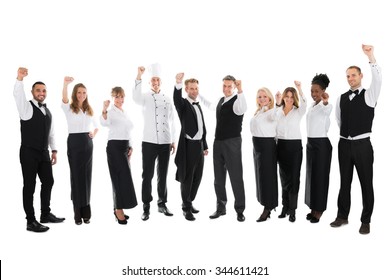 Full Length Portrait Of Happy Restaurant Staff Celebrating Success Against White Background