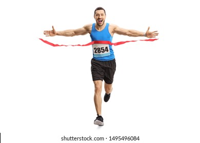 Full length portrait of a happy young man finishing a marathon race on the finish line isolated on white background