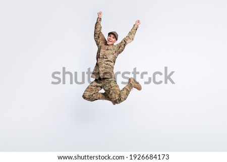 Full length portrait of impressed cheerful girl raise hands fist scream yeah isolated on white color background