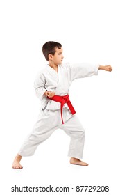 Full Length Portrait Of A Karate Child Posing Isolated On White Background