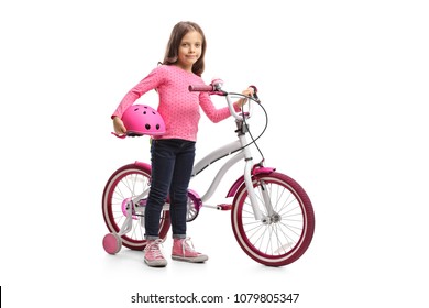 Full length portrait of a little girl with a bicycle and a helmet isolated on white background - Powered by Shutterstock