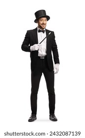 Full length portrait of a magician with a magic wand and top hat isolated on white background