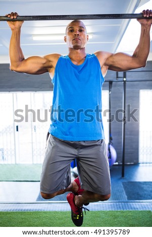 Similar – Image, Stock Photo Muscular man doing chin-ups