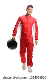 Full Length Portrait Of A Male Car Racer Holding A Helmet And Walking Towards The Camera Isolated On White Background