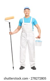 Full Length Portrait Of A Male House Painter Holding A Paint Roller, A Brush And A Color Bucket Isolated On White Background