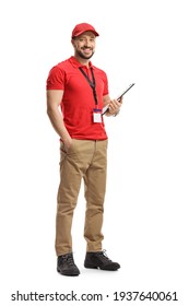 Full Length Portrait Of A Male Shop Assistant Holding A Clipboard And Smiling Isolated On White Background