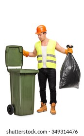 Full Length Portrait Of A Male Waste Collector Picking Up A Bag From A Trash Can Isolated On White Background