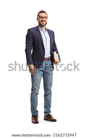 Full length portrait of a man with glasses holding books and smiling isolated on white background