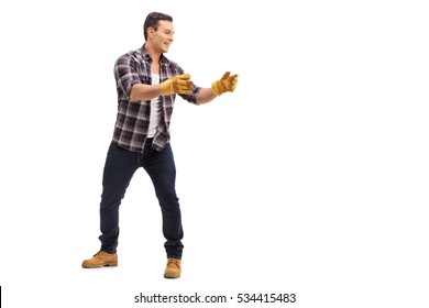 Full Length Portrait Of A Man Picking Up Something Isolated On White Background