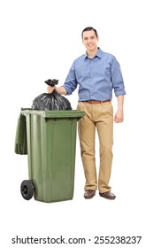 Full Length Portrait Of A Man Throwing Out Garbage Isolated On White Background