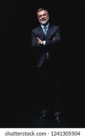 Full Length Portrait Of Mature Business Man Wearing Formal Suit Standing On Black Background