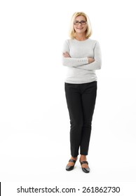 Full Length Portrait Of Mature Business Woman Standing Against White Background.