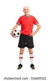 Full Length Portrait Of A Mature Man In A Red Jersey Holding A Football And Looking At The Camera Isolated On White Background