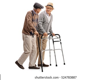 Full length portrait of a mature man with a walker and another man with a cane isolated on white background