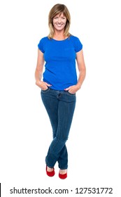 Full Length Portrait Of A Middle Aged Woman In Trendy Outfit Striking Stylish Pose.