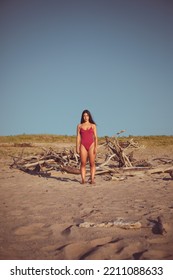 Full Length Portrait Of Natural Beauty Young Woman In Retro Swimwear At The Beach On Summer Vacation.