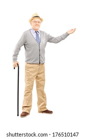 Full Length Portrait Of An Old Man With Cane Gesturing With Hand Isolated On White Background