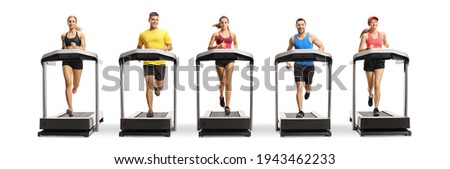 Full length portrait of people running on treadmills in a row isolated on white background
