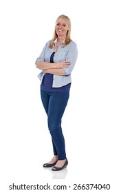 Full Length Portrait Of Pretty Mature Woman Standing With Her Arms Crossed On White Background