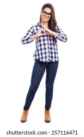 Full Length Portrait Of A Pretty Young Woman Making A Heart Sign With Her Hands