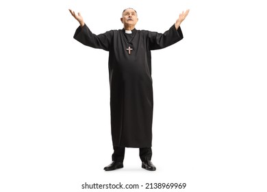 Full length portrait of a priest raising arms towards sky isolated on white background