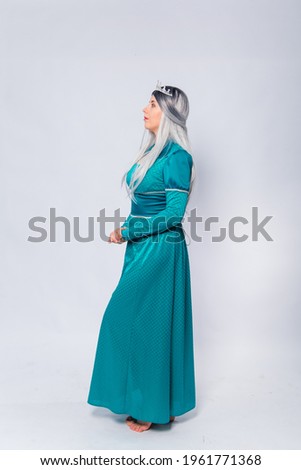 Full length portrait of a princess in a medieval, fantasy, turquoise dress with ash hair and a silver crown, posing isolated on a white background.