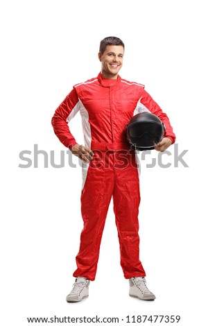 Full length portrait of a racer standing and holding a helmet isolated on white background