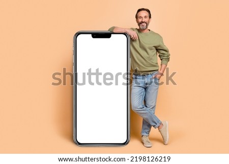 Full length portrait of satisfied friendly person lean empty space proposition blank isolated on beige color background