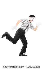 Full Length Portrait Of A Scared Male Mime Artist Running Away Isolated On White Background