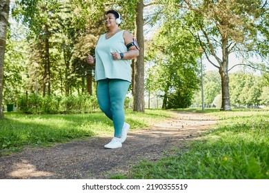 Full Length Portrait Of Senior Black Woman Enjoying Morning Run In Park, Copy Space