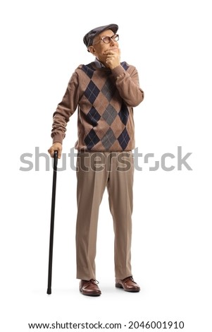 Full length portrait of a senior man with a walking cane standing and thinking isolated on white background