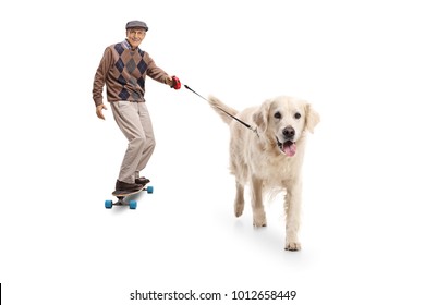 Full length portrait of a senior riding a longboard and walking a dog isolated on white background - Powered by Shutterstock