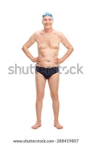 Full length portrait of a shirtless senior in black swim trunks and blue swimming cap looking at the camera and smiling isolated on white background