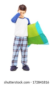 Full Length Portrait Of Sleepy Kid Holding A Pillow Isolated On White Background