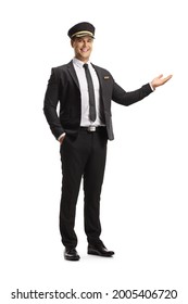 Full Length Portrait Of A Smiling Chauffeur Gesturing With Hand Isolated On White Background