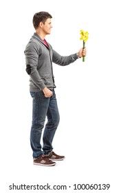 Full Length Portrait Of A Smiling Man Holding A Bunch Of Flowers Isolated On White Background