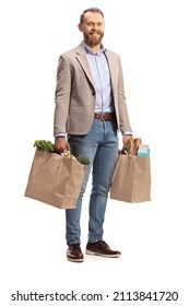 Full Length Portrait Of A Smiling Young Man Carrying Grocery Bags Isolated On White Background