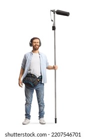 Full Length Portrait Of A Sound Engineer Holding A Microphone On A Stick And Smiling Isolated On White Background