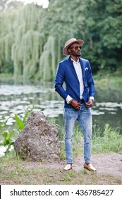 Full Length Portrait Of Stylish Black Man At Jacket, Hat And Sunglasses