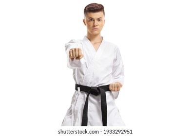 Full length portrait of a teenage boy exercising karate kata isolated on white background