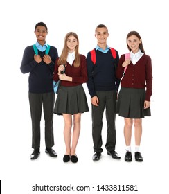 Full Length Portrait Of Teenagers In School Uniform With Backpacks On White Background