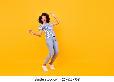 Full Length Portrait Of Terrified Impressed Girl Stand Tiptoe Balancing Empty Space Abyss Isolated On Yellow Color Background