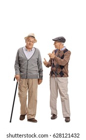 Full Length Portrait Of Two Elderly Men Walking Towards The Camera And Talking To Each Other Isolated On White Background