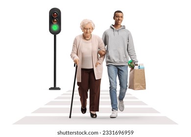 Full length portrait of a young african american man helping an elderly woman with grocery bags and crossing a street isolated on white background - Powered by Shutterstock