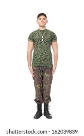 Full Length Portrait Of Young Army Soldier Standing In Attention Isolated On White Background